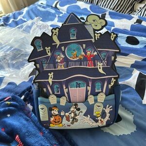 Loungefly Disney Mickey and friends haunted house glow in the dark backpack